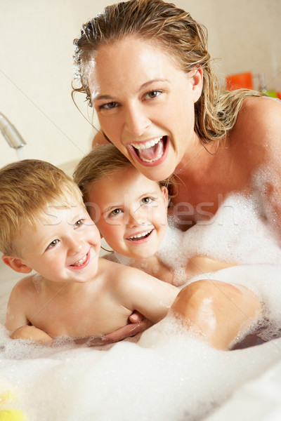 Mother With Children Relaxing In Bubble Filled Bath Stock photo © monkey_business