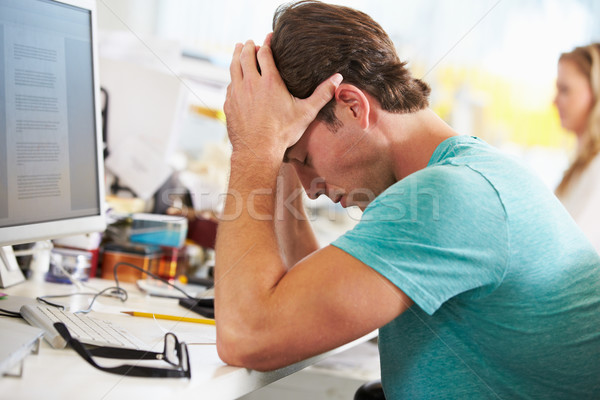 Mann arbeiten Schreibtisch beschäftigt kreative Stock foto © monkey_business