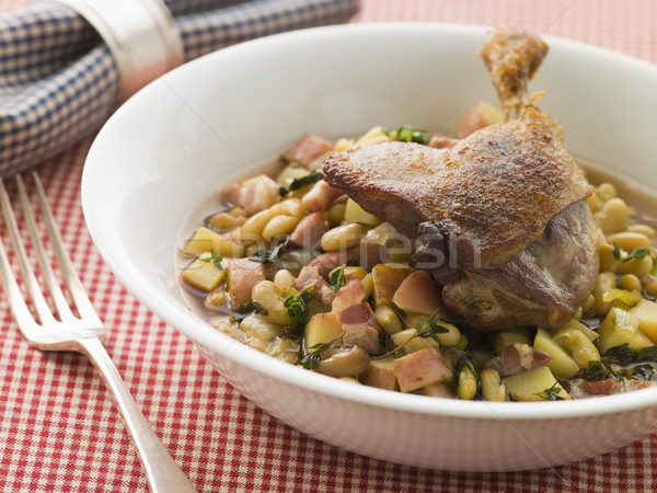 Stock photo: Confit Duck Leg with Flageolet Beans and Bacon