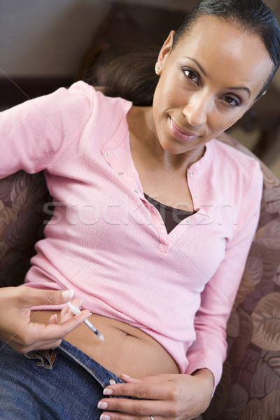 Woman injecting drugs to prepare for IVF treatment Stock photo © monkey_business
