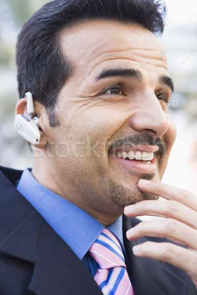 Om de afaceri bluetooth tehnologie comunicare persoană zâmbitor Imagine de stoc © monkey_business