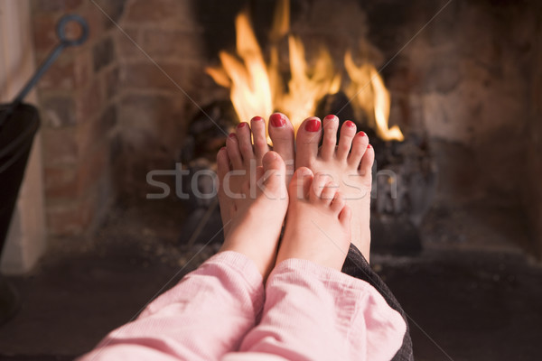 ストックフォト: 母親 · フィート · 暖炉 · 女性 · 子供 · 火災
