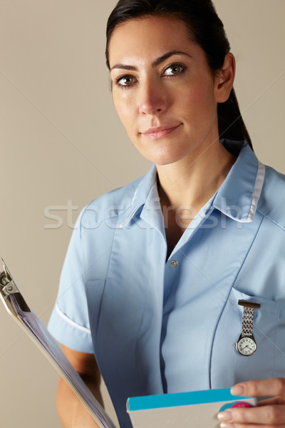 UK nurse holding prescription drug pack Stock photo © monkey_business