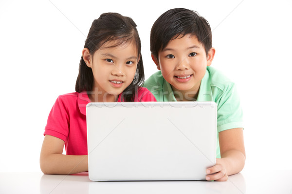 Studio Shot Of Two Chinese Children With Laptop Stock photo © monkey_business