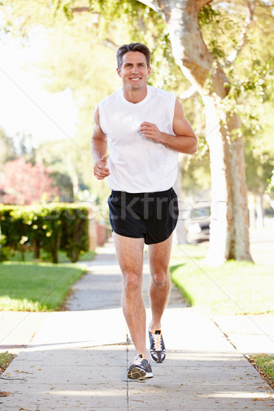Male Runner Exercising On Suburban Street Stock photo © monkey_business