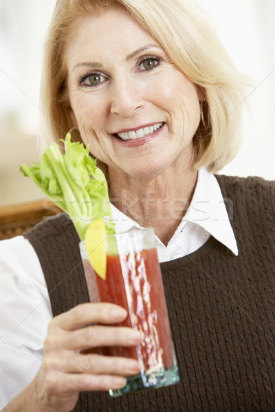 Woman Drinking A Bloody Mary Stock photo © monkey_business