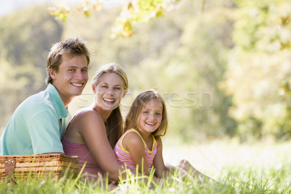 Family at park having a picnic and smiling Stock photo © monkey_business