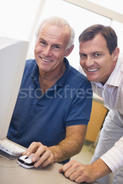 Mature male student learning computer skills Stock photo © monkey_business