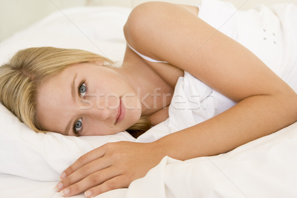 Stock photo: Woman lying in bed