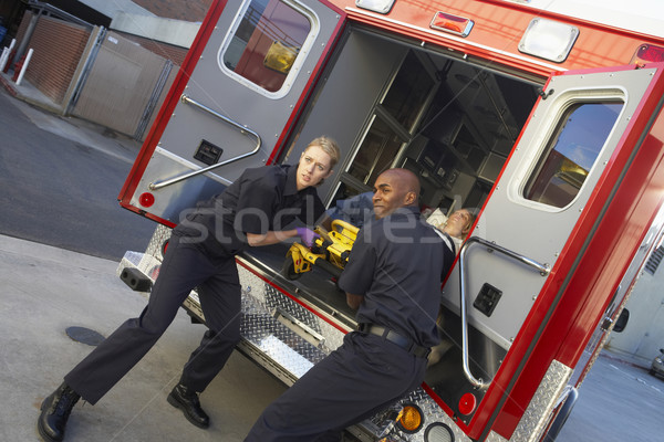 Paramedics preparing to unload patient from ambulance Stock photo © monkey_business