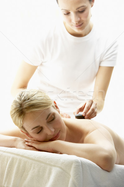 Stock photo: Young Woman Enjoying Hot Stone Treatment