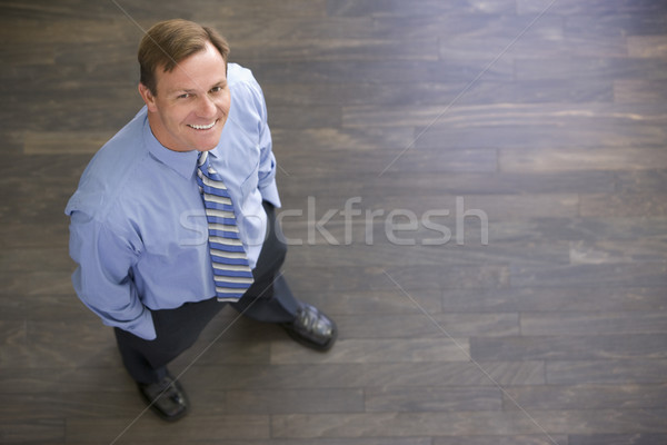 Geschäftsmann stehen drinnen lächelnd Mann Arbeit Stock foto © monkey_business