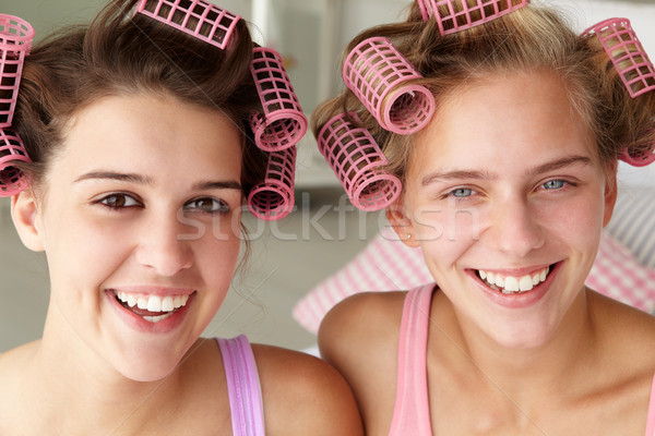 Teenage girls with hair in curlers Stock photo © monkey_business