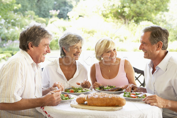 Friends Eating An Al Fresco Lunch Stock photo © monkey_business