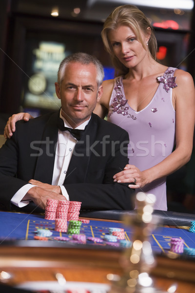 Stock photo: Couple gambling at roulette table