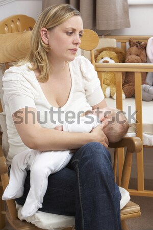 A young woman lying on her couch drinking tea Stock photo © monkey_business