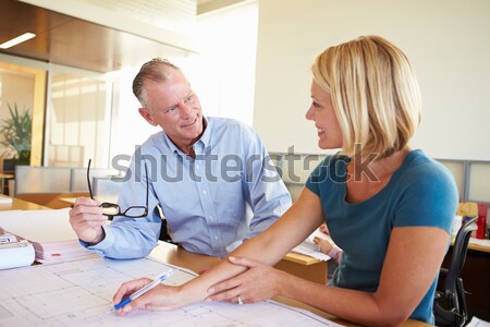 A teacher instructs a schoolgirl in a high school class Stock photo © monkey_business