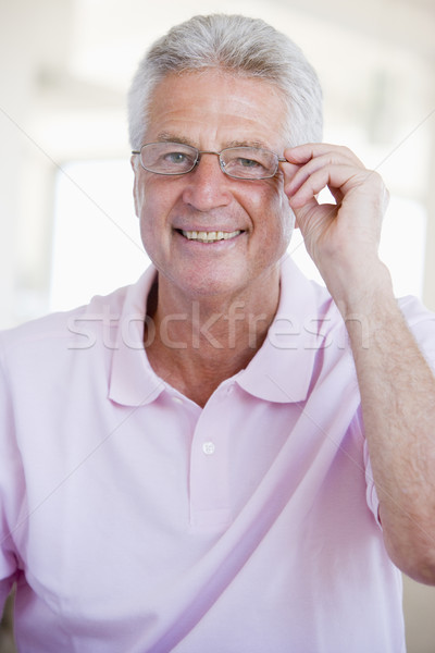 Stock photo: Man Looking Through New Glasses