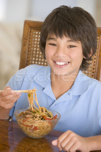 Young boy in dining room eating chinese food smiling Stock photo © monkey_business