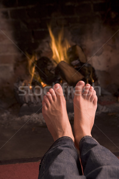 ストックフォト: フィート · 暖炉 · 火災 · 男 · 幸せ · ホーム