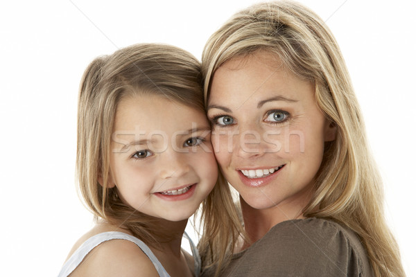 Studio Portrait Of Mother Hugging Young Daughter Stock photo © monkey_business