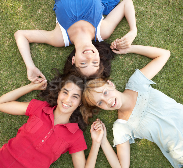 Stock photo: Group Of Teenager Girls Looking Up Into Camera