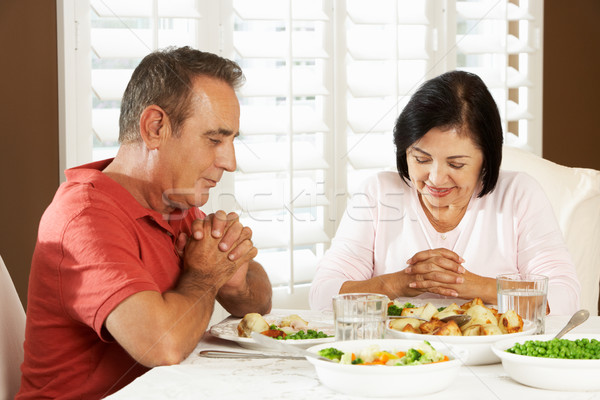 Senior Couple Saying Grace Before Meal At Home Stock photo © monkey_business