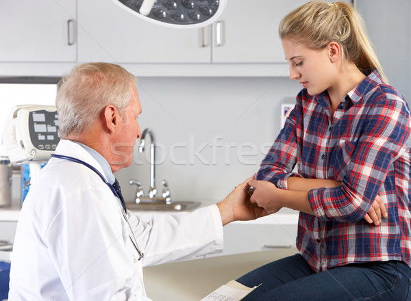 Teenage Girl Visits Doctor's Office With Elbow Pain Stock photo © monkey_business