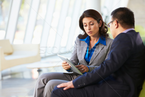 Businesspeople With Digital Tablet Sitting In Modern Office Stock photo © monkey_business