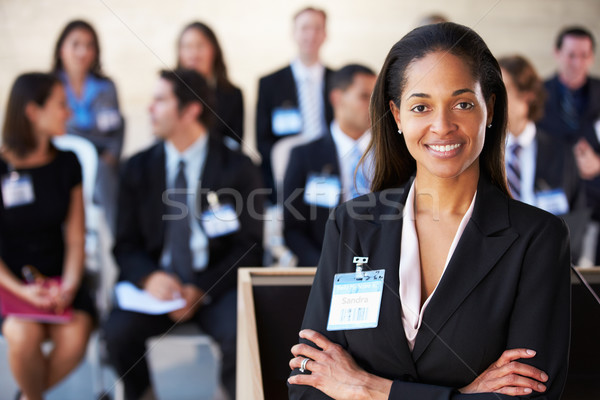 Stock photo: Businesswoman Delivering Presentation At Conference