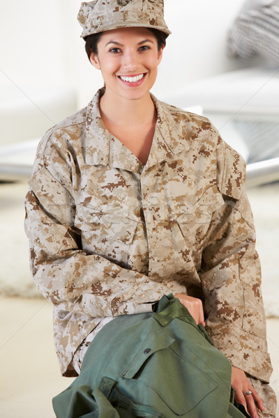 Stock photo: Female Soldier With Kit Bag Home For Leave