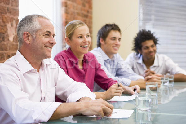 Quatre gens d'affaires boardroom souriant table gens d'affaires [[stock_photo]] © monkey_business