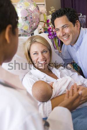 Three young women drinking tea together in their pyjamas Stock photo © monkey_business