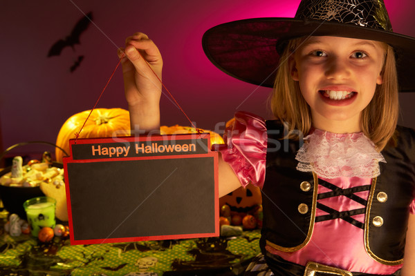 Halloween party with a child holding sign in hand Stock photo © monkey_business