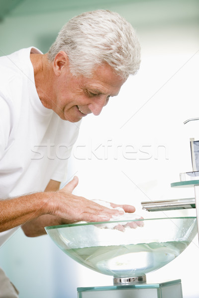 Stock photo: Man in bathroom with shaving cream smiling