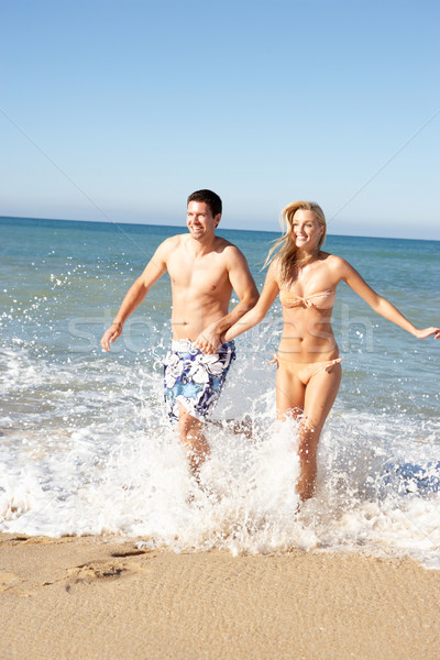 Young Couple Enjoying Beach Holiday Stock photo © monkey_business