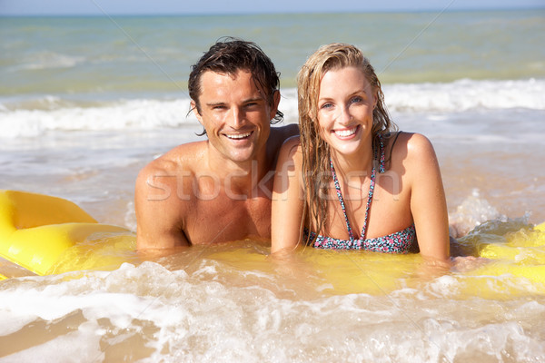 Young couple on beach holiday Stock photo © monkey_business