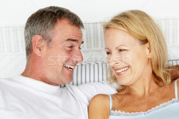Couple tête épaules heureux lit Photo stock © monkey_business
