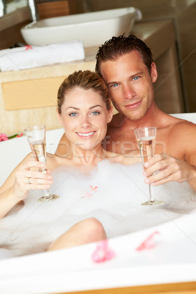 Couple Relaxing In Bath Drinking Champagne Together Stock photo © monkey_business