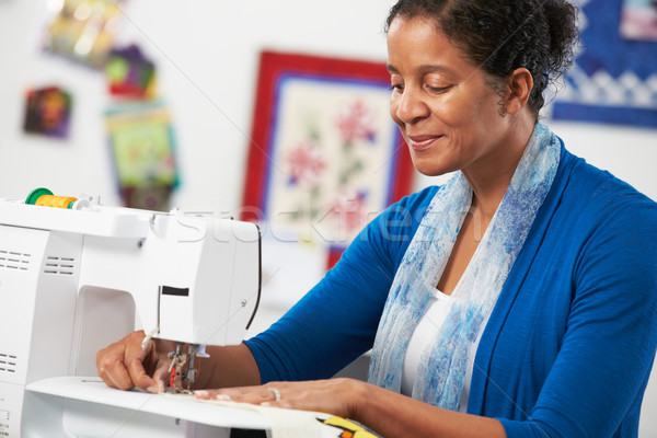 Woman Using Electric Sewing Machine Stock photo © monkey_business