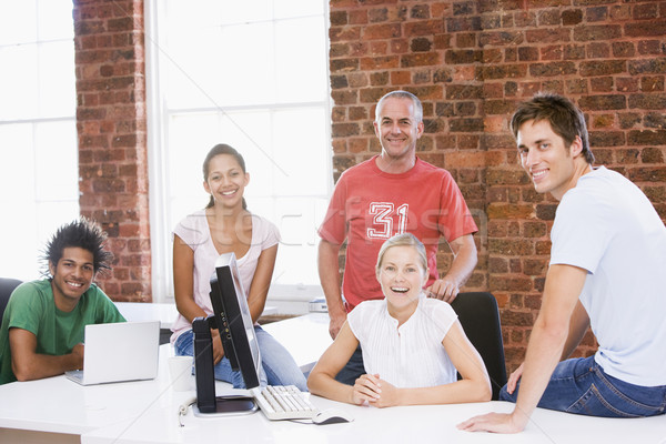 Five businesspeople in office space smiling Stock photo © monkey_business