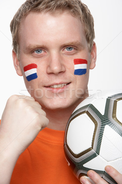 Young Male Football Fan With Dutch Flag Painted On Face Stock photo © monkey_business