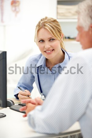 Young doctor with senior patient Stock photo © monkey_business
