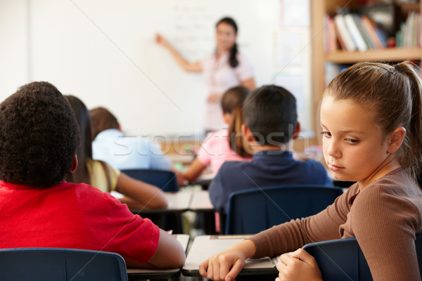 Malheureux écolière classe enfants livres travaux [[stock_photo]] © monkey_business