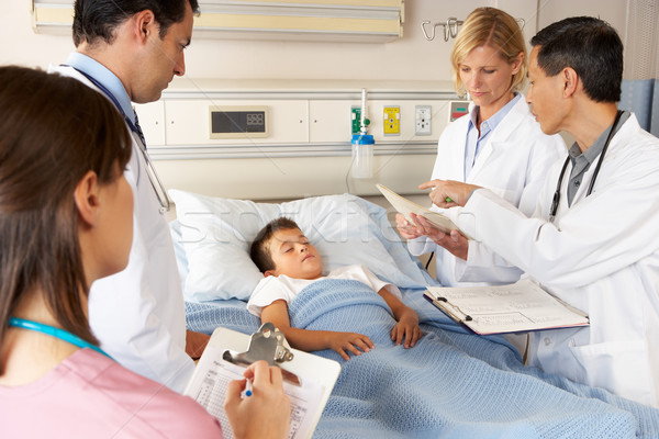 Medical Team Visiting Child Patient On Ward Round Stock photo © monkey_business