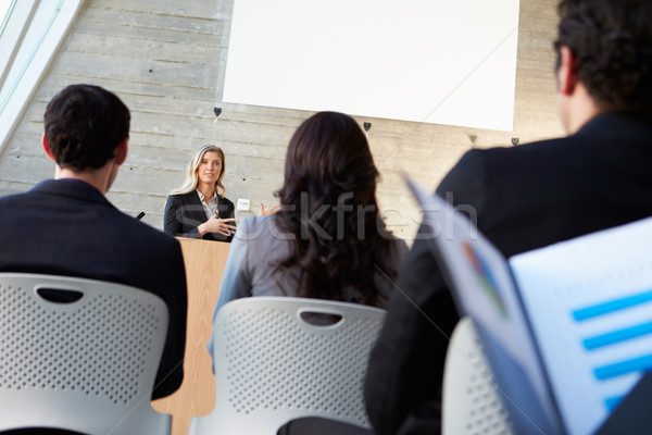 Zakenvrouw presentatie conferentie business man mannen Stockfoto © monkey_business