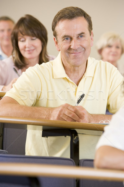 Masculina adulto estudiante escuchar Universidad conferencia Foto stock © monkey_business