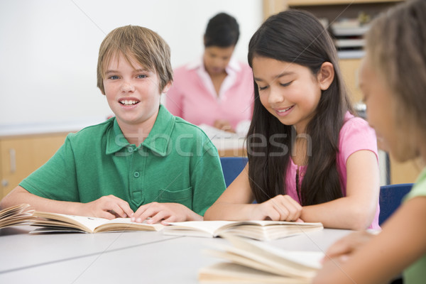 Group of elementary school pupils in classroom Stock photo © monkey_business