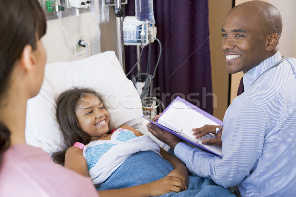 Doctor Making Notes On Young Girl  Stock photo © monkey_business