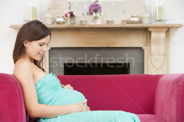 Foto d'archivio: Donna · incinta · seduta · soggiorno · sorridere